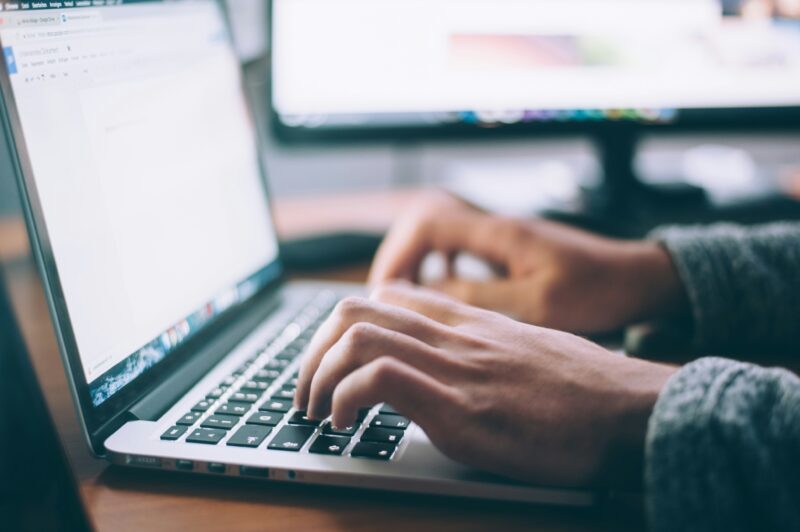 Picture of a man working on a laptop
